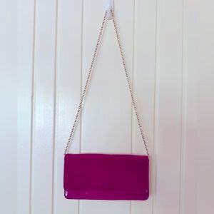 Aldo Clutch Purse. Magenta faux suede/patent leather combination.